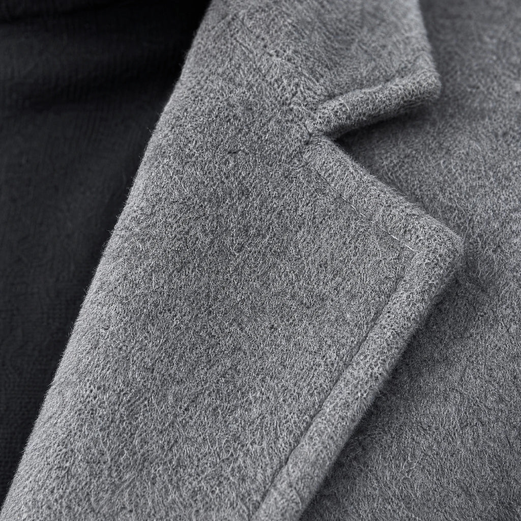 Manteau mi-long uni à revers crantés vintage - close-up détail matière